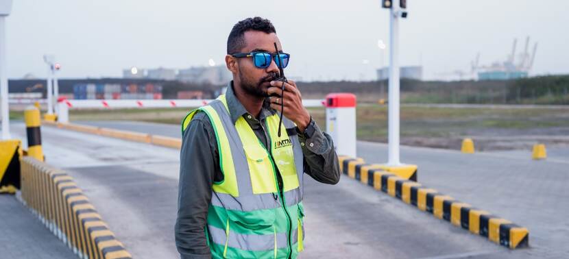 Man with walkie talkie in harbour Mozambique.