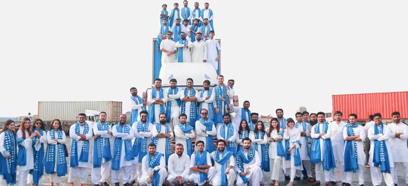 Truck it In Group employees together for group picture in Pakistan